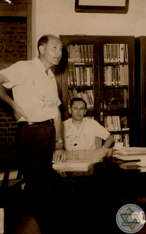 A photo of Robert E Marshak and Leonard I Schiff at Matscience in 1963 showing signs of damage.